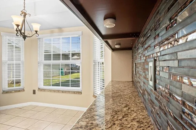 a view of hallway with windows