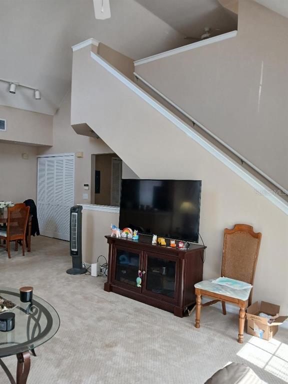 5581 Rosehill Road, Unit 203 Sarasota, FL 34233 - Photo 5 of 17 a view of a livingroom with furniture and a flat screen tv
