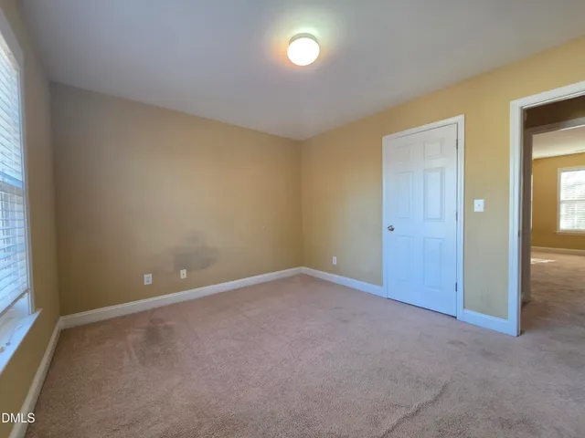 an empty room with a fan