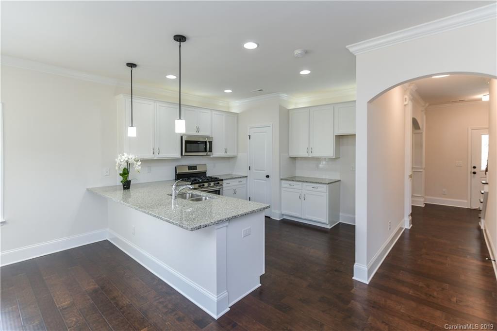 5810 Carmel Road Charlotte, NC 28226 - Photo 11 of 31 a kitchen with sink stove and refrigerator