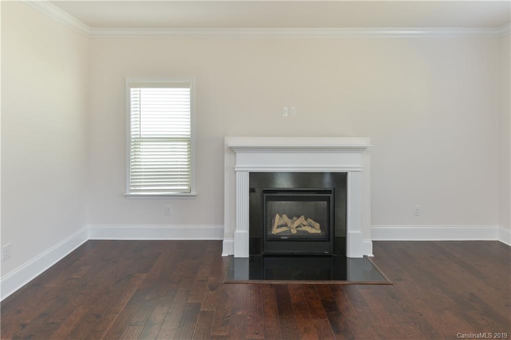 5810 Carmel Road Charlotte, NC 28226 - Photo 16 of 31 a living room with a fireplace