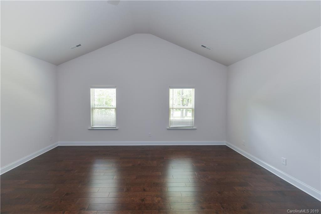 5810 Carmel Road Charlotte, NC 28226 - Photo 17 of 31 a view of wooden floor and windows in a room