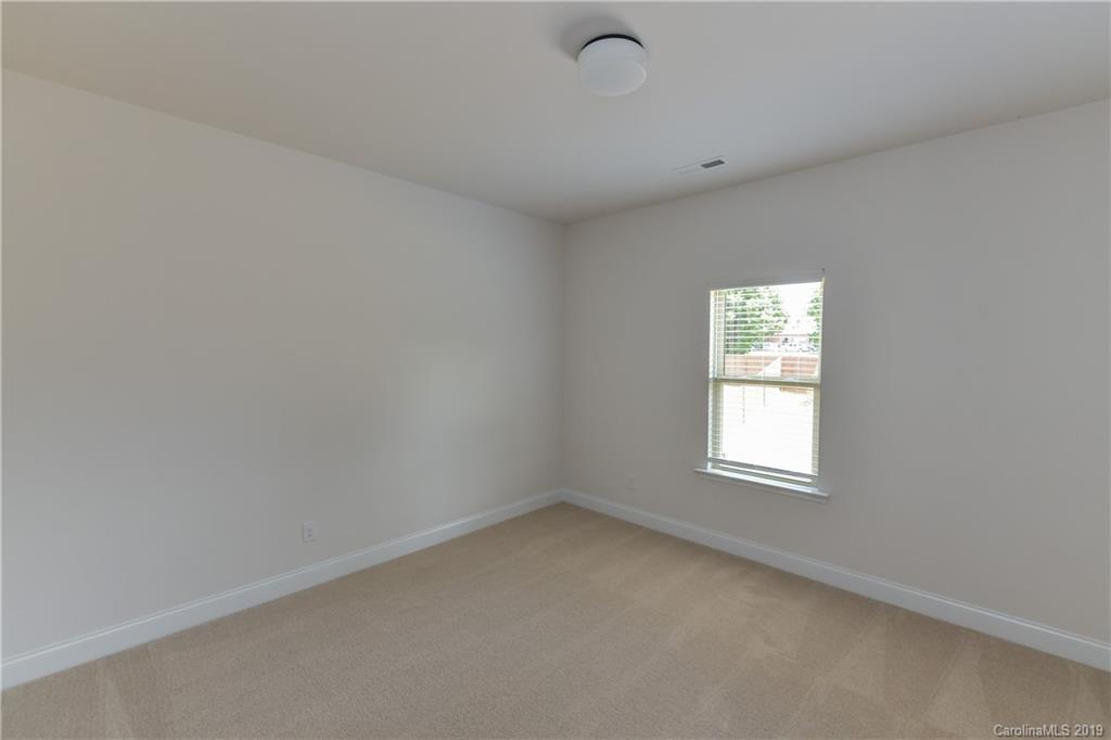 5810 Carmel Road Charlotte, NC 28226 - Photo 24 of 31 an empty room with a window
