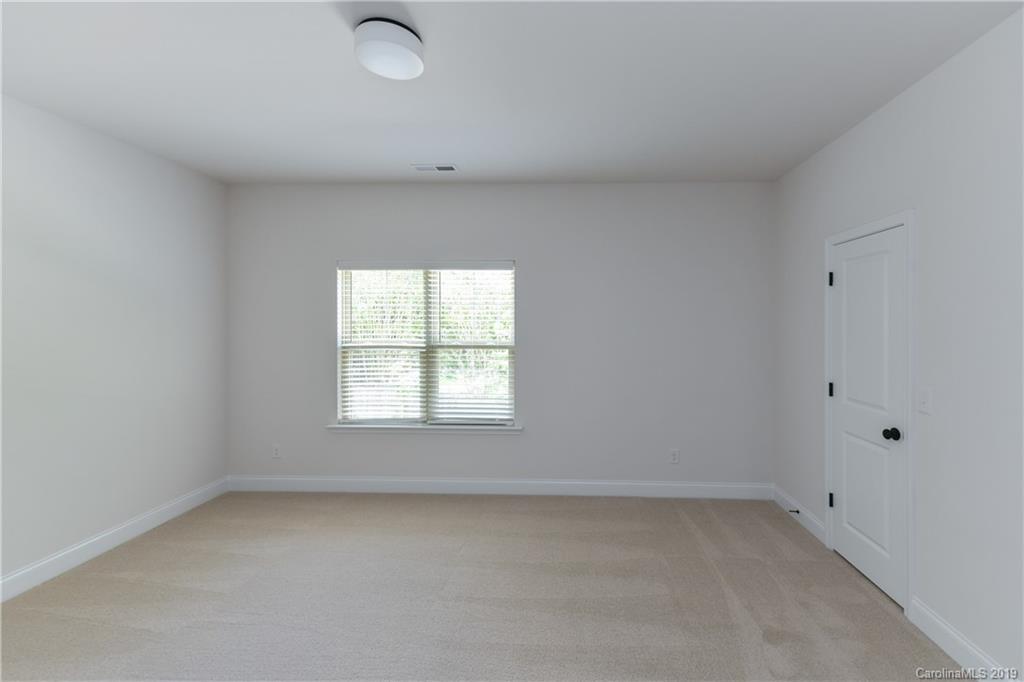 5810 Carmel Road Charlotte, NC 28226 - Photo 27 of 31 an empty room with a window