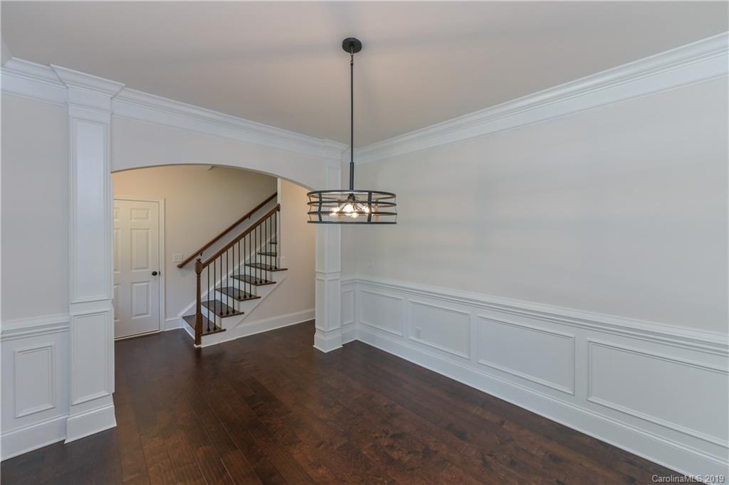 5810 Carmel Road Charlotte, NC 28226 - Photo 5 of 31 a view of entryway and hall with wooden floor