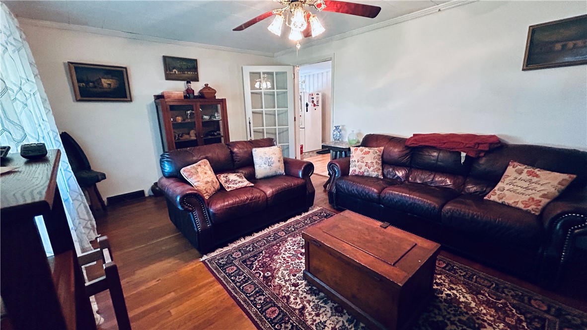608 29 N Bypass Anderson, SC 29621 - Photo 9 of 20 Hardwood floors and French doors enhance this warm, inviting living space.