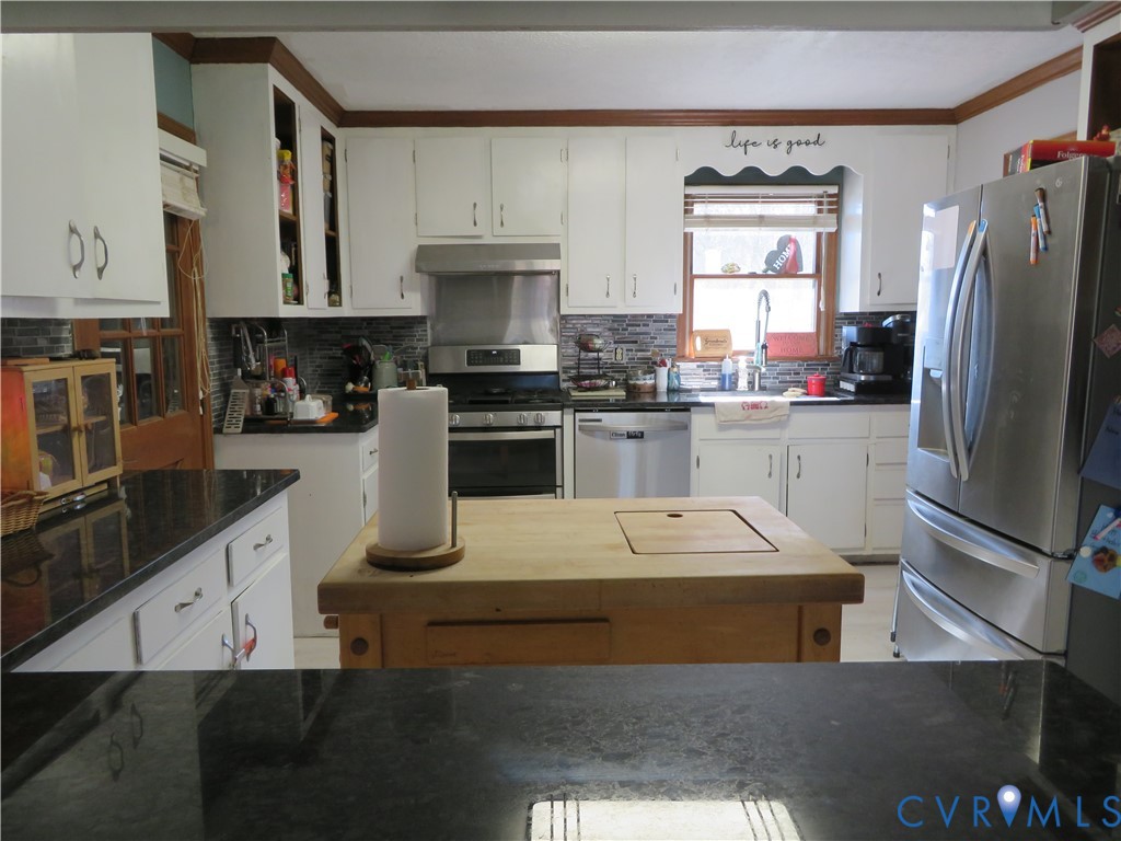 44 Adsit Lane Freeman, VA 23856 - Photo 29 of 58 a kitchen with stainless steel appliances granite countertop a sink stove and refrigerator