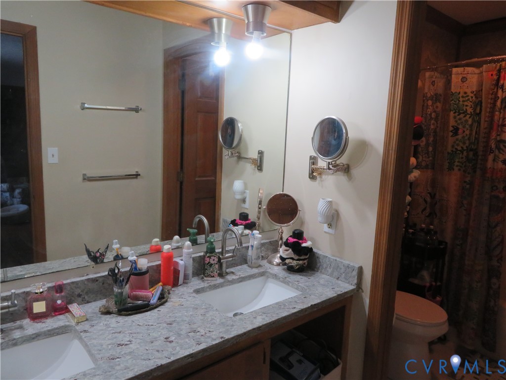 44 Adsit Lane Freeman, VA 23856 - Photo 50 of 58 a bathroom with a sink and mirror