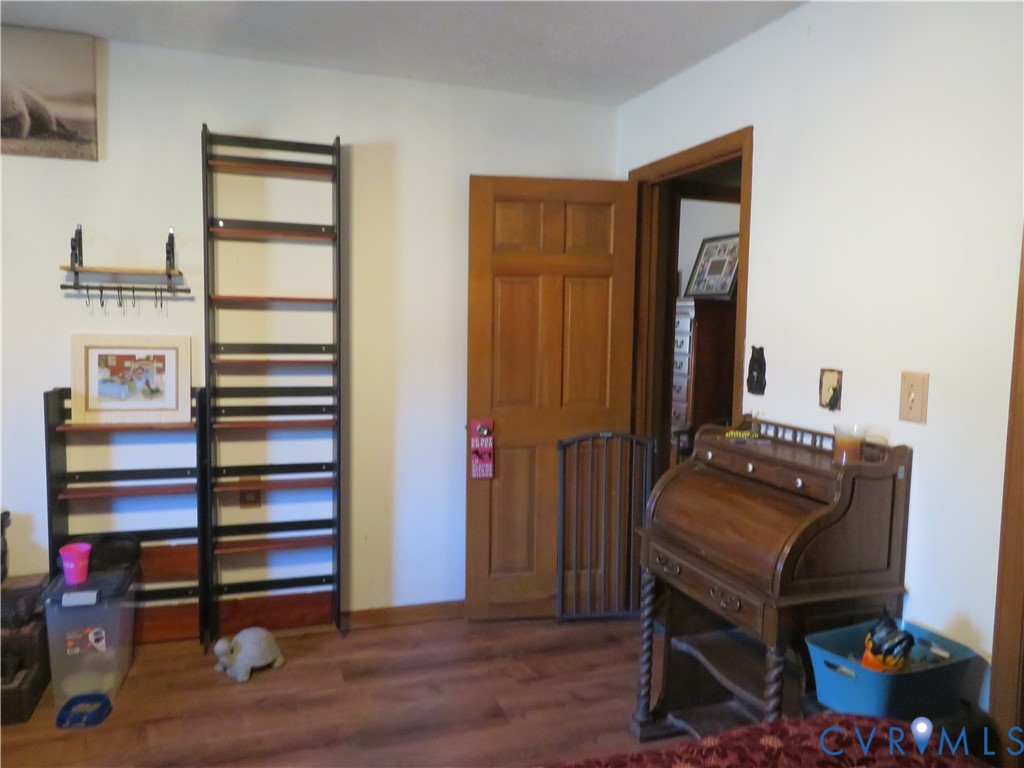 44 Adsit Lane Freeman, VA 23856 - Photo 52 of 58 a room with a walk in closet and wooden floor
