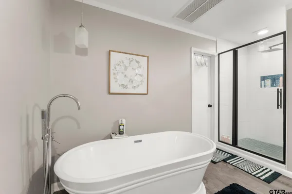 a spacious bathroom with a granite countertop double vanity sink mirror and