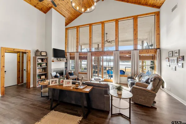 a living room with furniture and large window