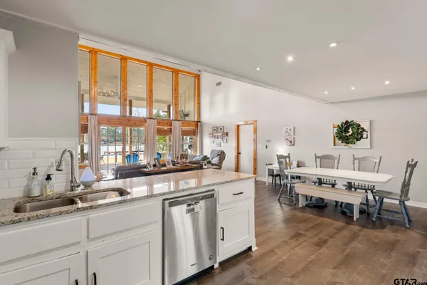 a kitchen with stainless steel appliances and white cabinets