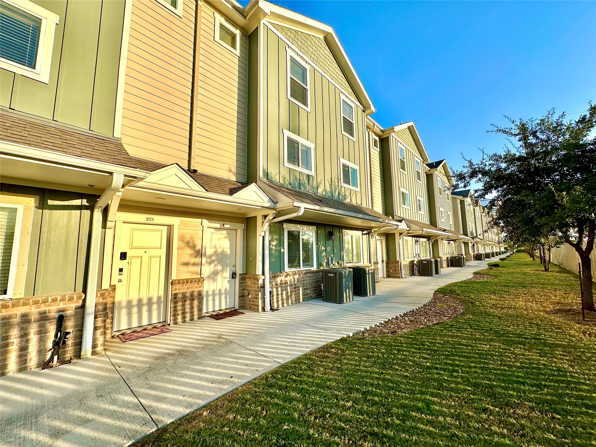21155 Gosling Road, Unit 6C Spring, TX 77388 - Photo 1 of 20 a front view of a building with a garden