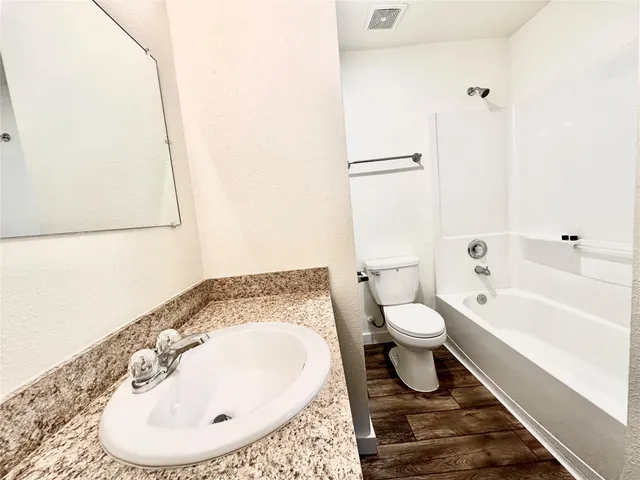 a bathroom with a toilet and a sink