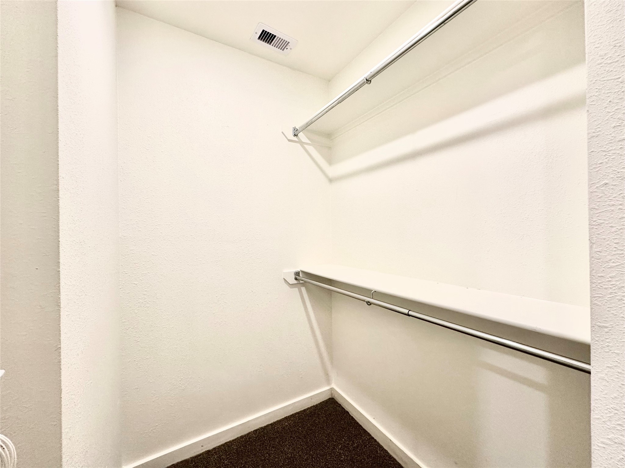 21155 Gosling Road, Unit 6C Spring, TX 77388 - Photo 17 of 20 a view of closet with wooden floor