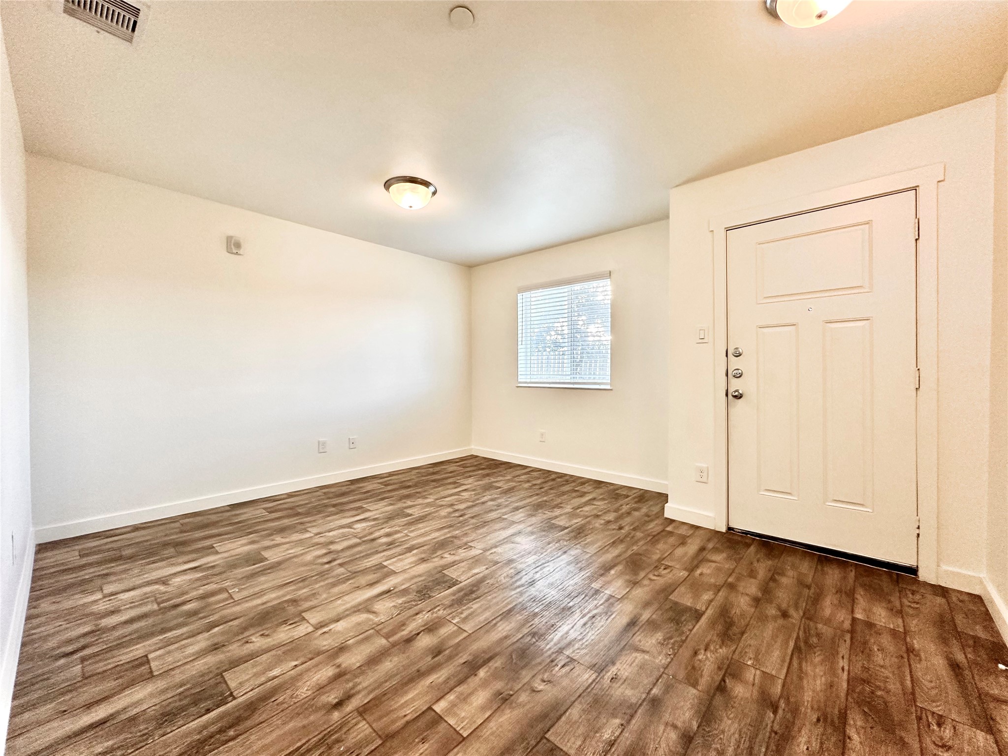 21155 Gosling Road, Unit 6C Spring, TX 77388 - Photo 4 of 20 a view of empty room with wooden floor