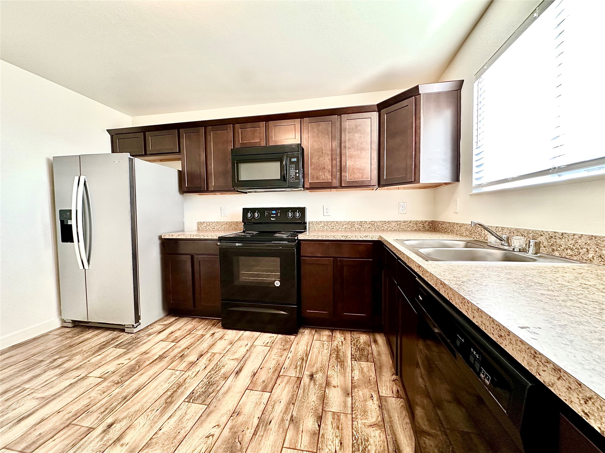 21155 Gosling Road, Unit 6C Spring, TX 77388 - Photo 7 of 20 a kitchen with stainless steel appliances granite countertop a refrigerator and a sink