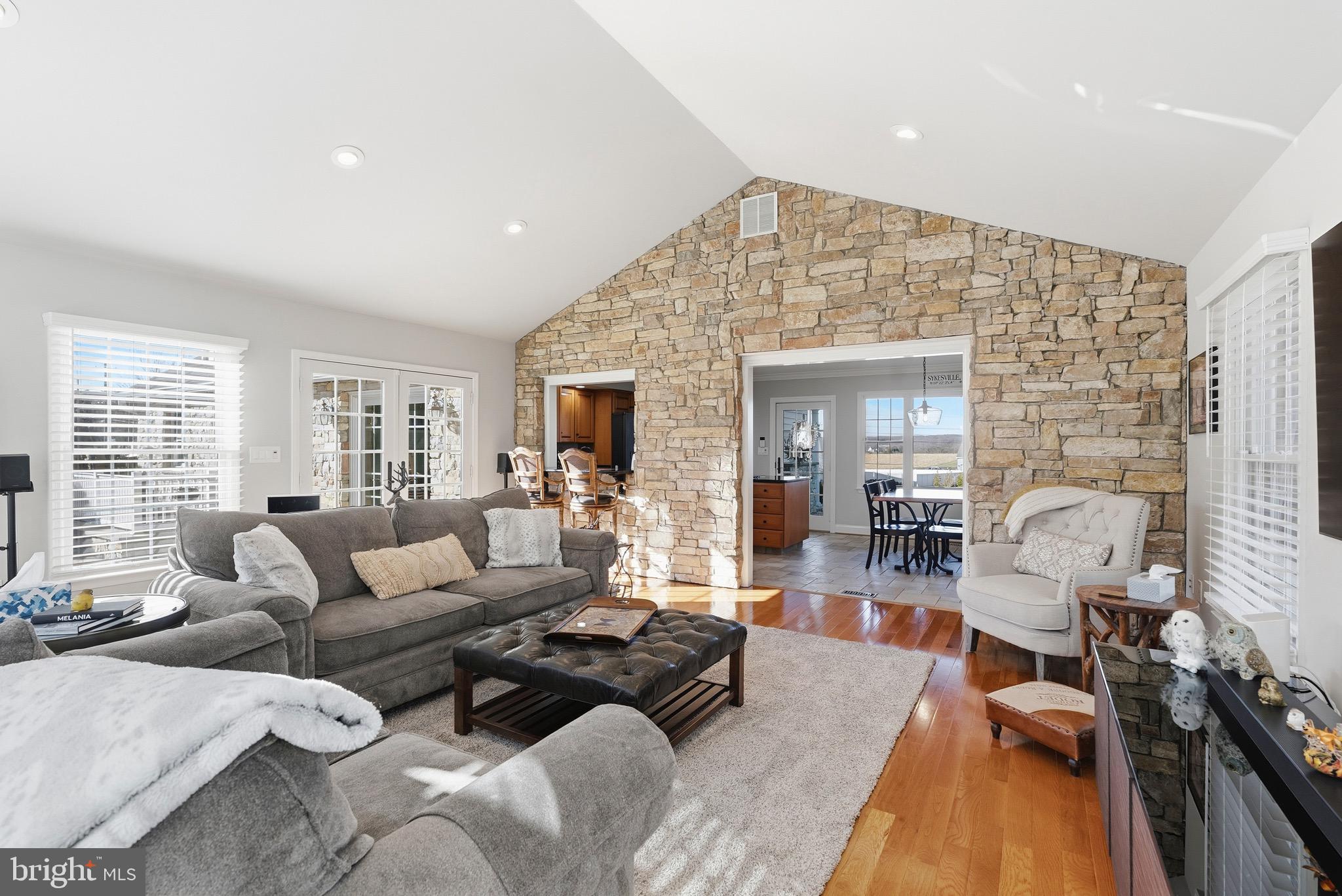 6837 White Rock Road Sykesville, MD 21784 - Photo 22 of 36 a living room with furniture and a wooden floor