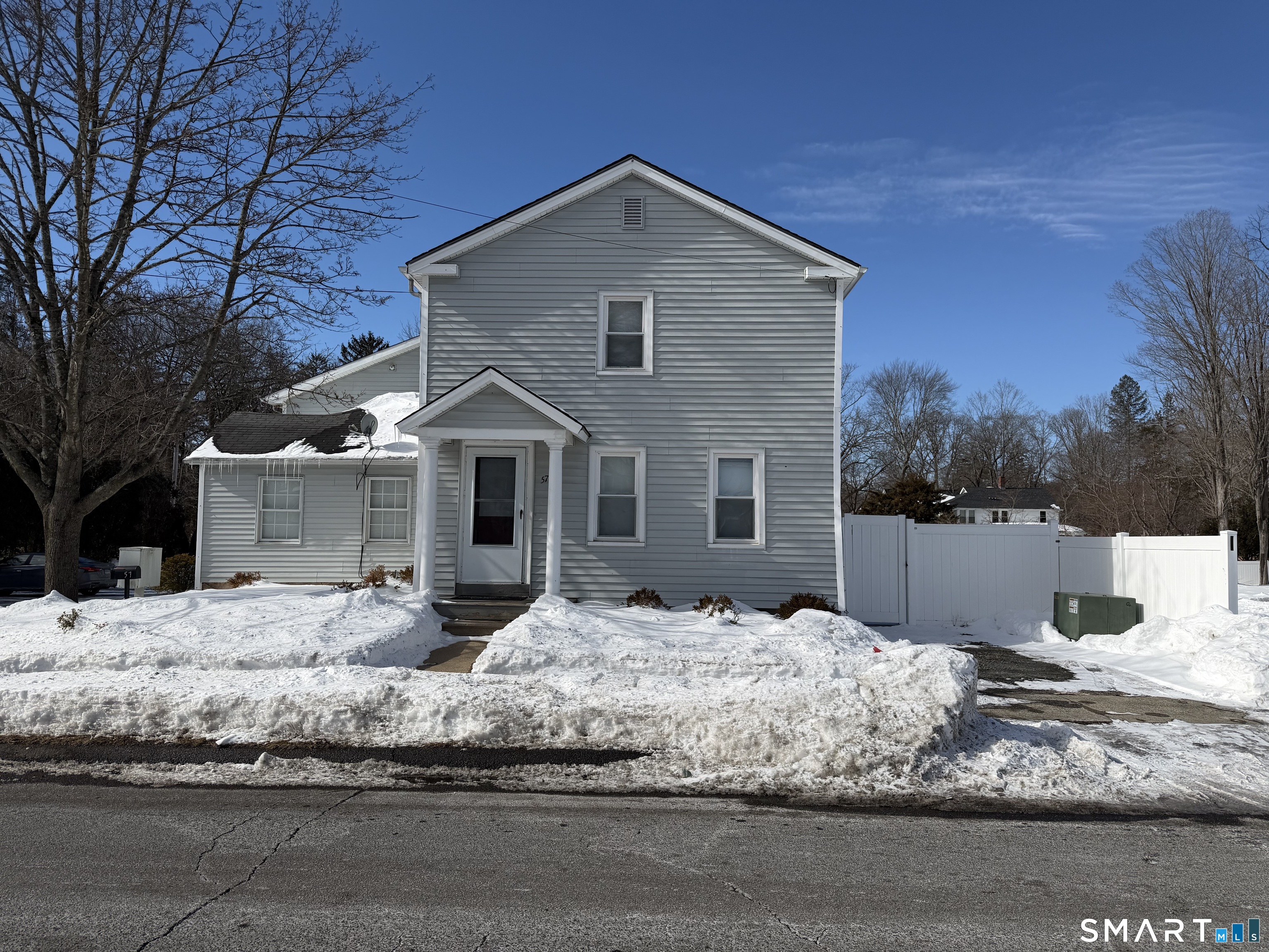 57 Chapel Street Wallingford, CT 06492 - Photo 1 of 18 a front view of a house with a yard