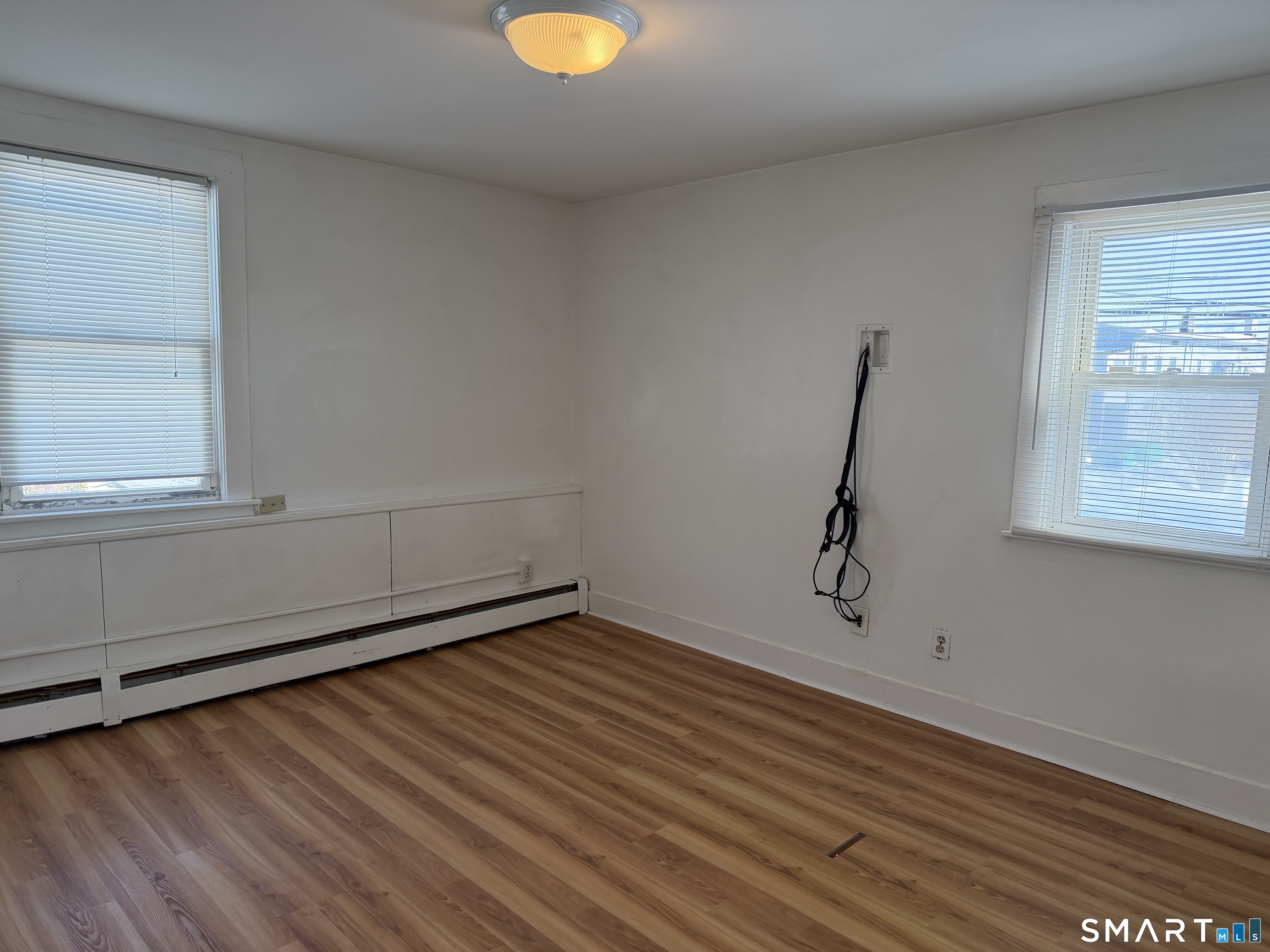 57 Chapel Street Wallingford, CT 06492 - Photo 12 of 18 a view of a room with wooden floor and window
