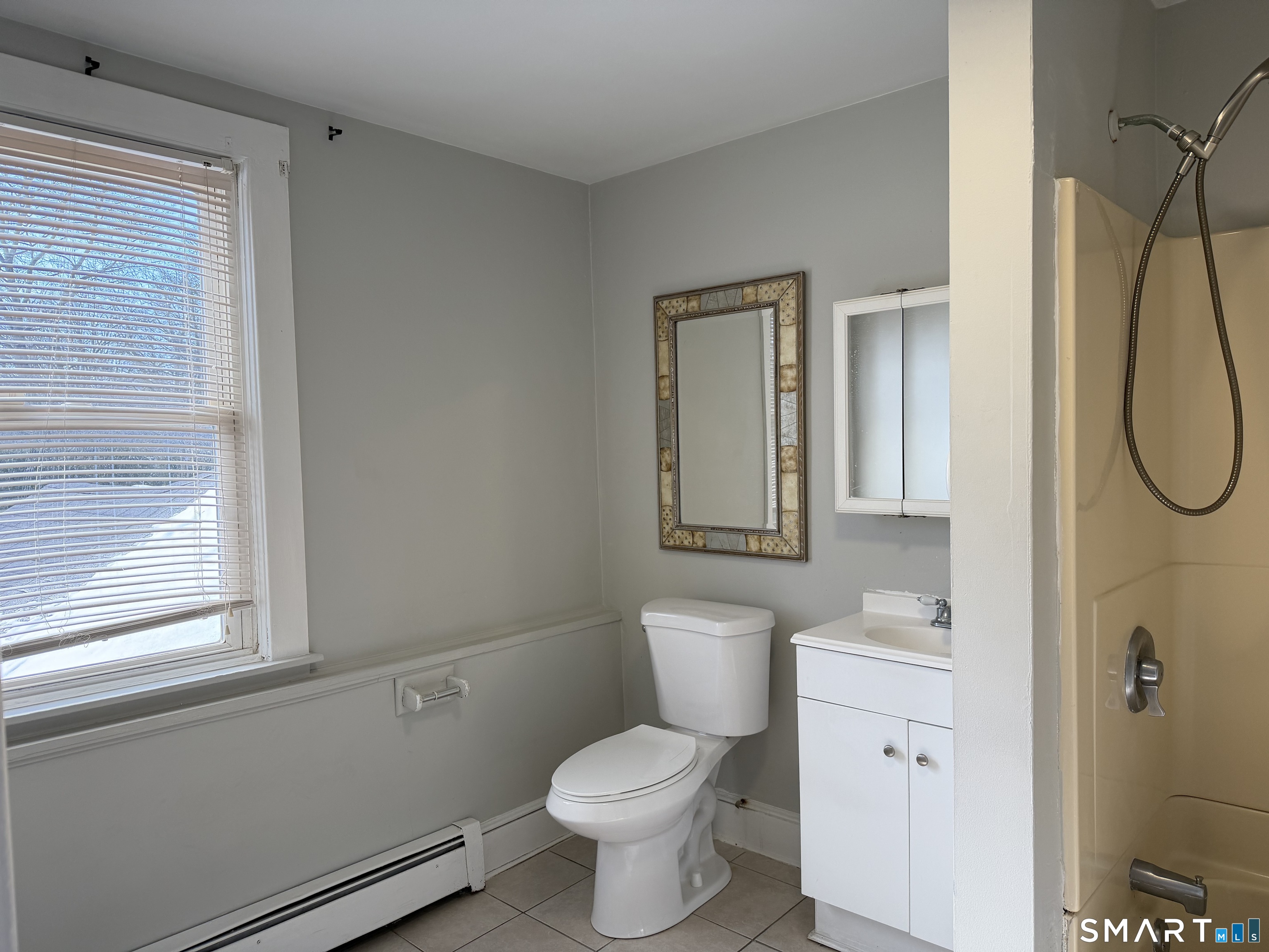 57 Chapel Street Wallingford, CT 06492 - Photo 15 of 18 a bathroom with a toilet sink and shower