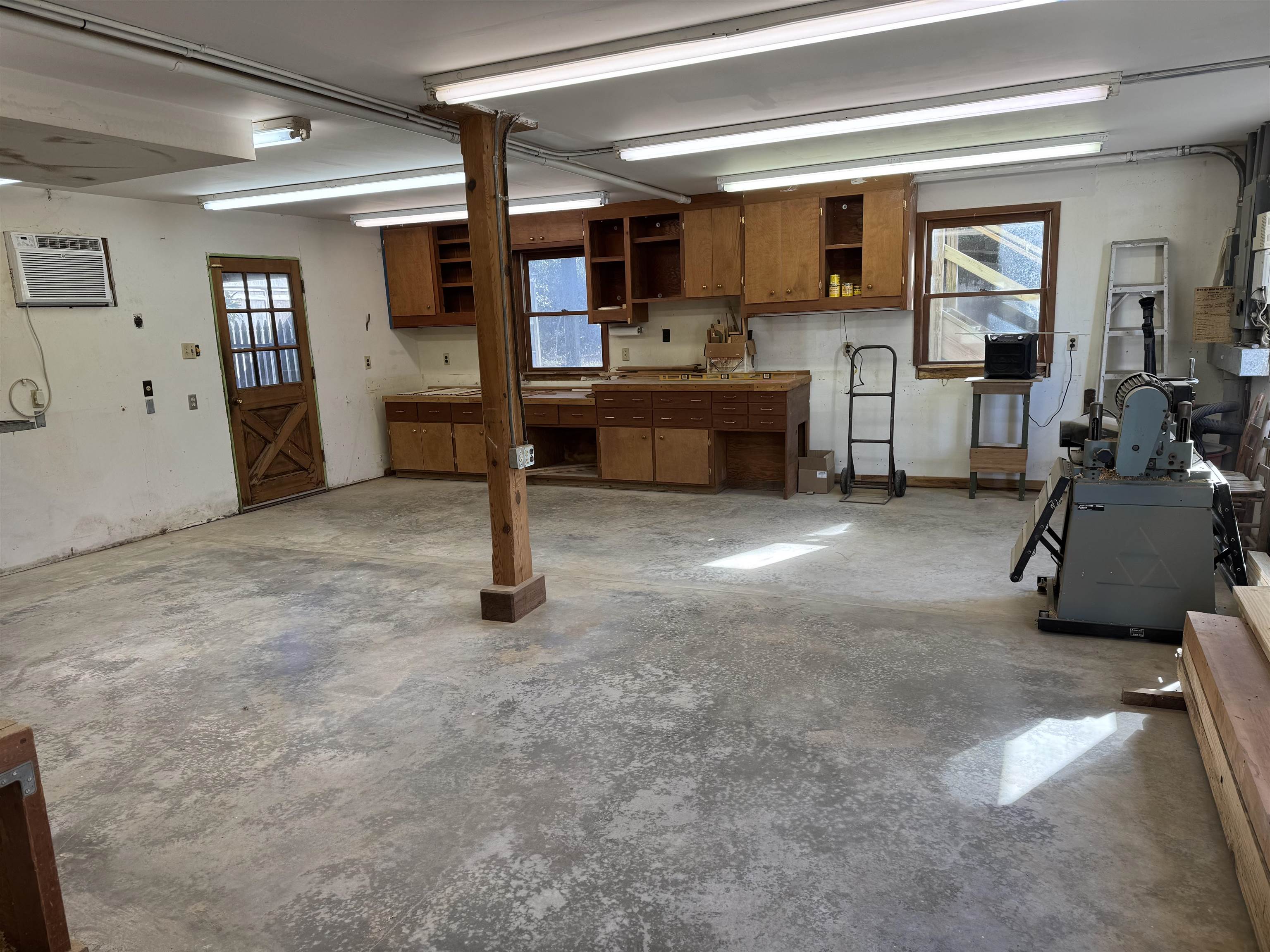 707 Thomas Avenue North Myrtle Beach, SC 29582 - Photo 35 of 39 Garage with an AC wall unit