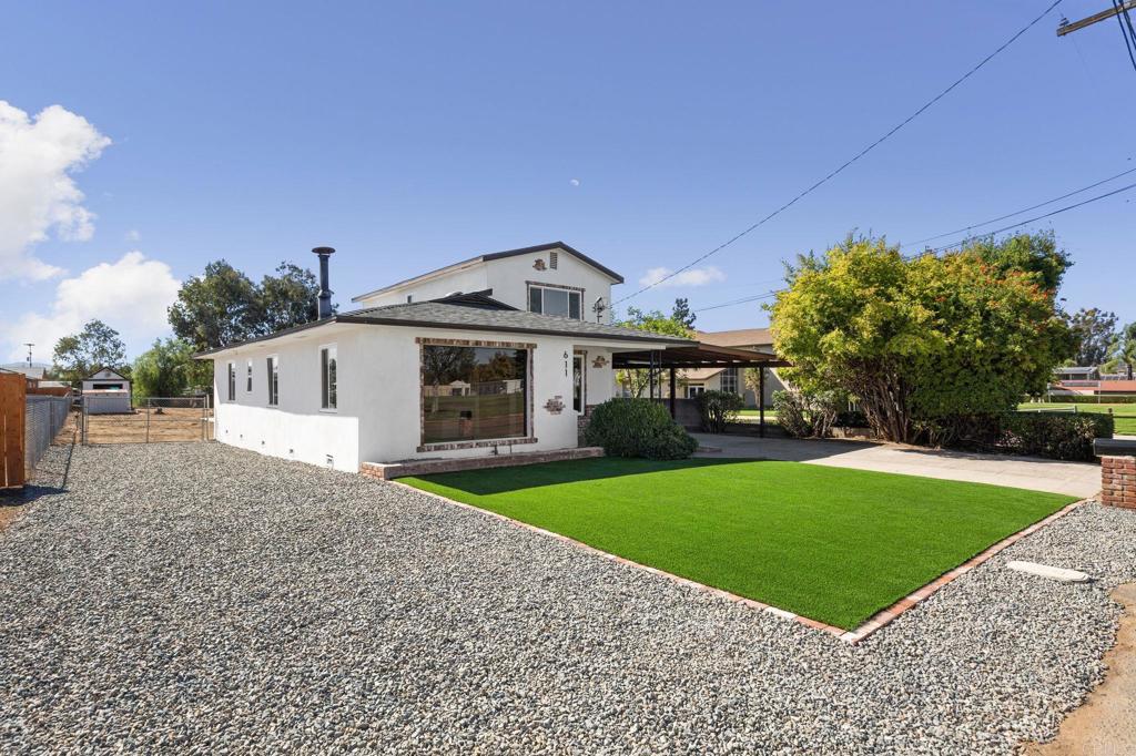 611 9th Street Ramona, CA 92065 - Photo 1 of 39 a front view of a house with a yard and garage