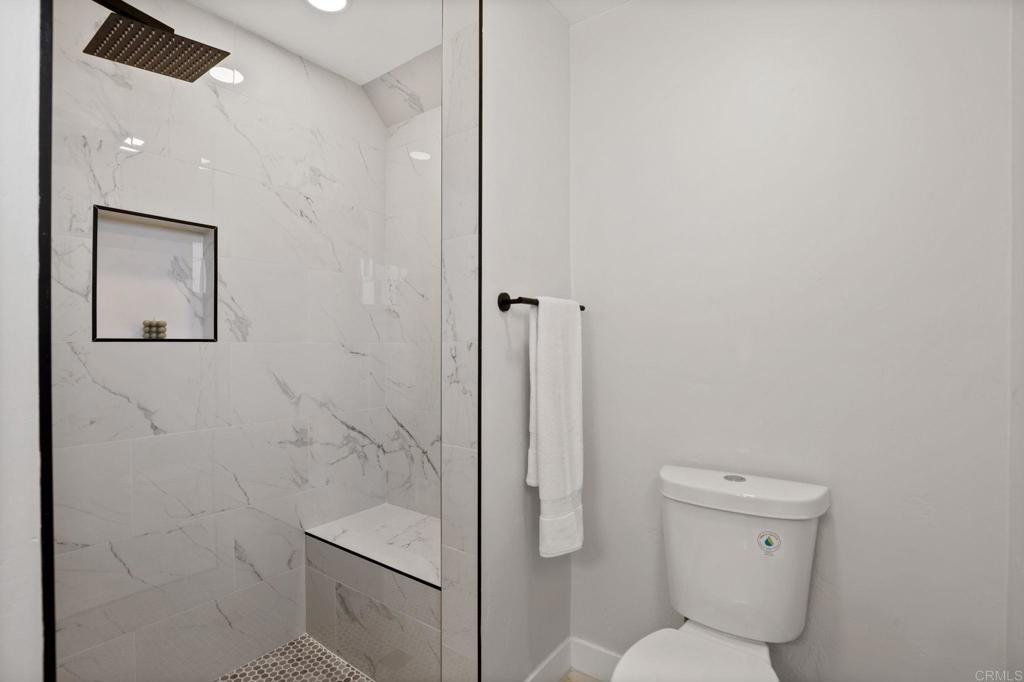 611 9th Street Ramona, CA 92065 - Photo 22 of 39 a bathroom with a toilet and a shower