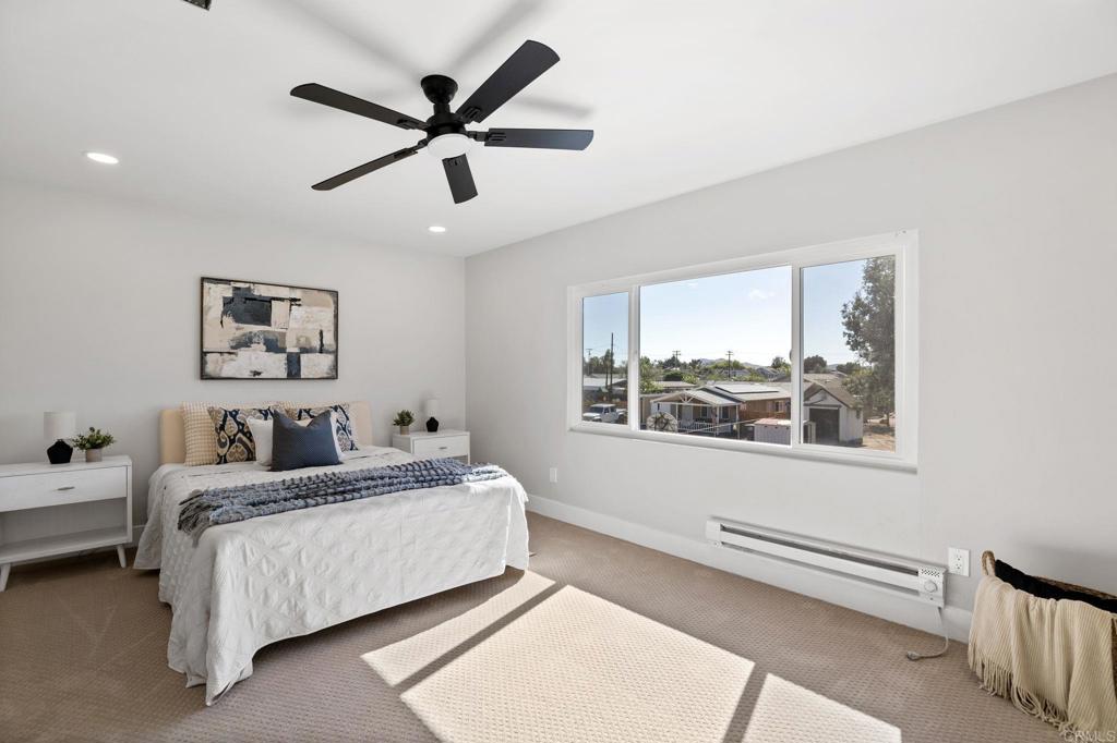611 9th Street Ramona, CA 92065 - Photo 24 of 39 a bedroom with a bed and a large window