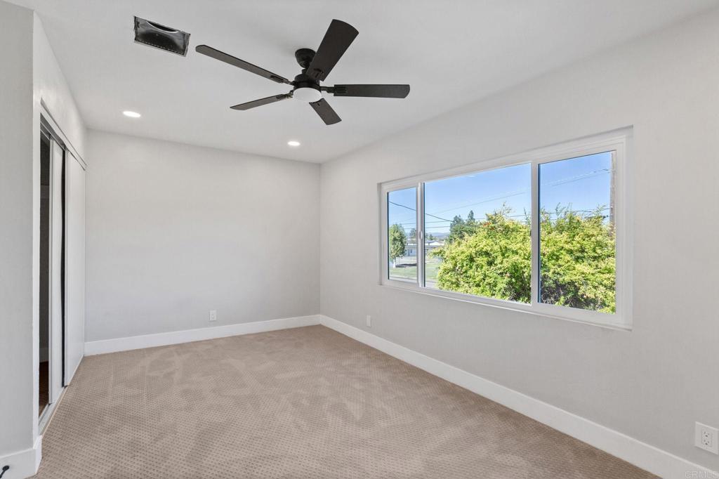 611 9th Street Ramona, CA 92065 - Photo 28 of 39 an empty room with windows and ceiling fan
