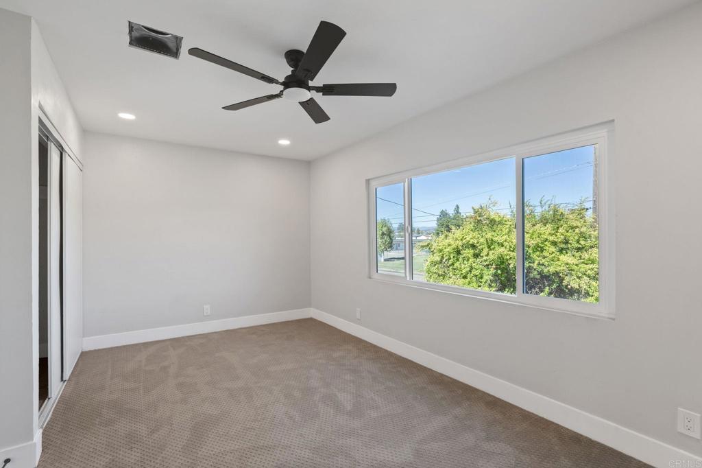 611 9th Street Ramona, CA 92065 - Photo 29 of 39 a view of a ceiling fan and a window in a room
