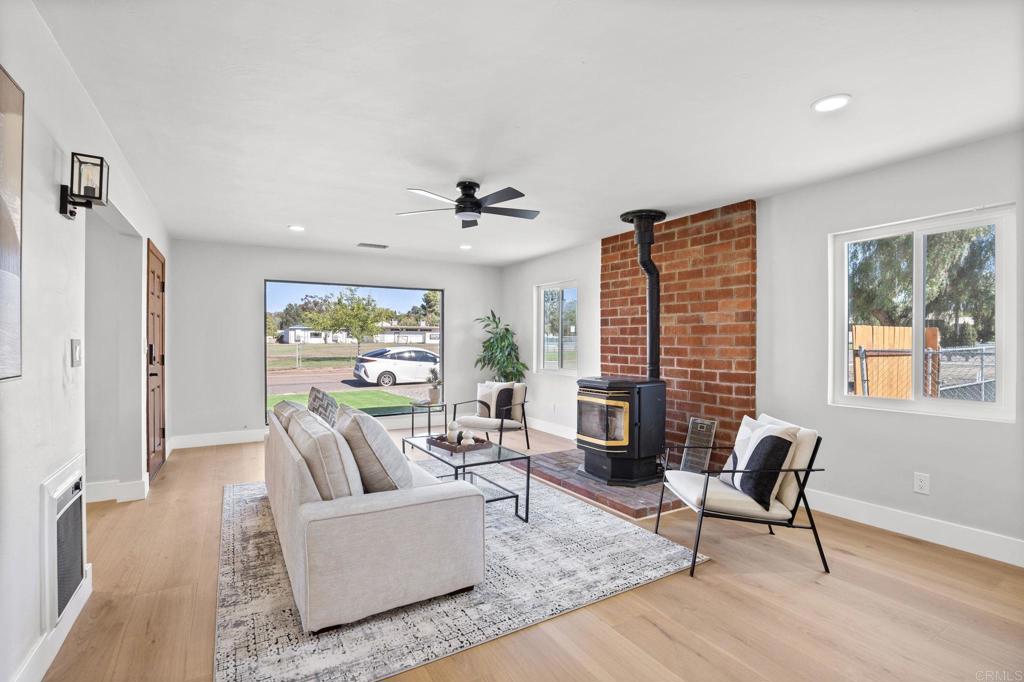 611 9th Street Ramona, CA 92065 - Photo 5 of 39 a living room with furniture and a fireplace
