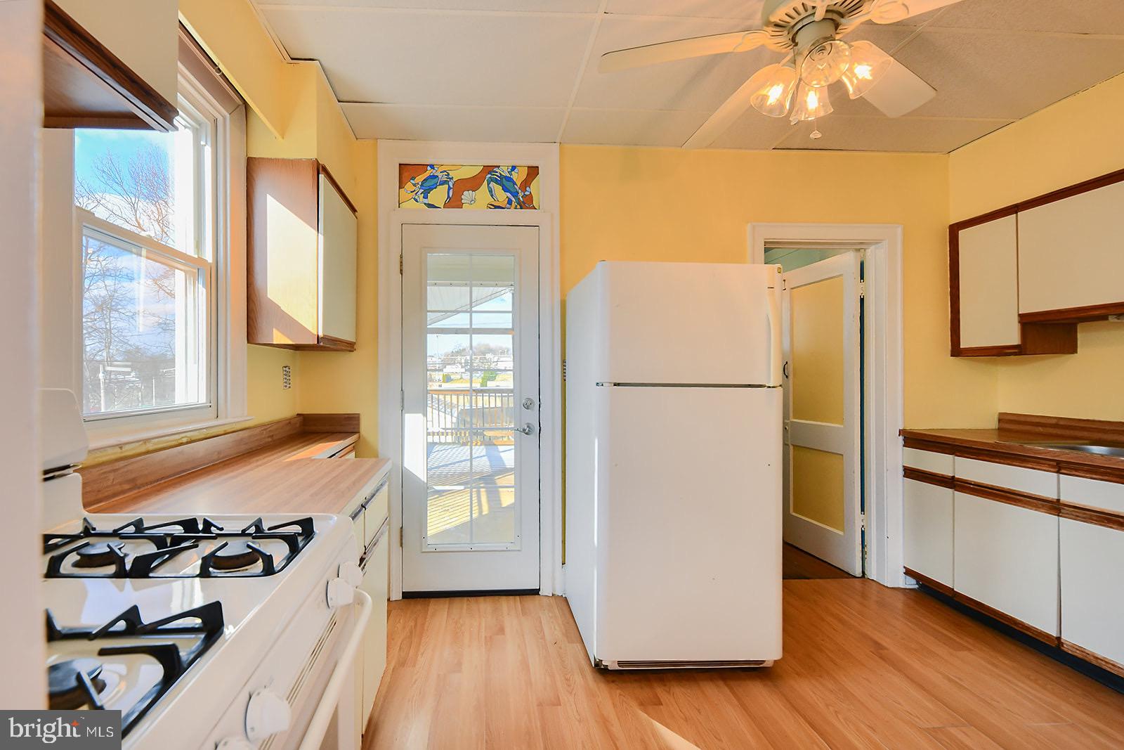 112 Linhigh Avenue Nottingham, MD 21236 - Photo 11 of 45 Bright and airy kitchen with cheerful decor.