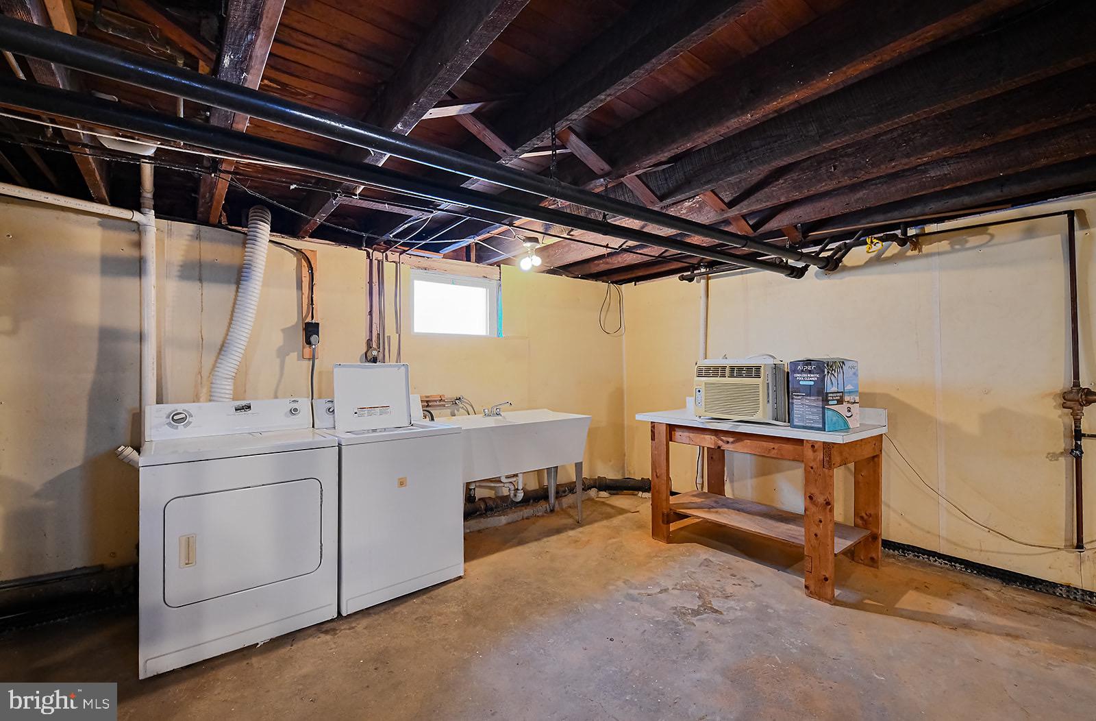112 Linhigh Avenue Nottingham, MD 21236 - Photo 34 of 45 Spacious basement laundry area with natural light.