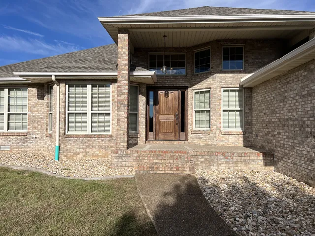 a view of a house with a door and a window