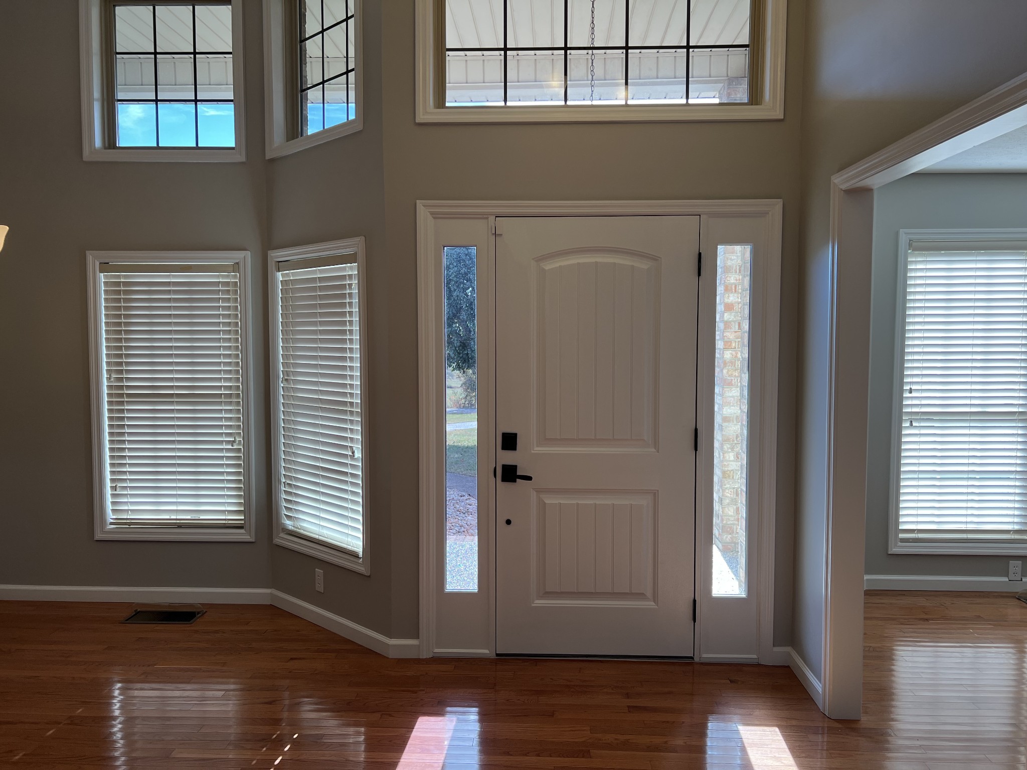3716 Scottsville Road Lafayette, TN 37083 - Photo 5 of 21 a view of empty room with wooden floor and windows