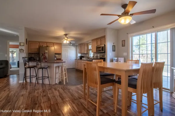 a view of a dining room with furniture window and wooden floor