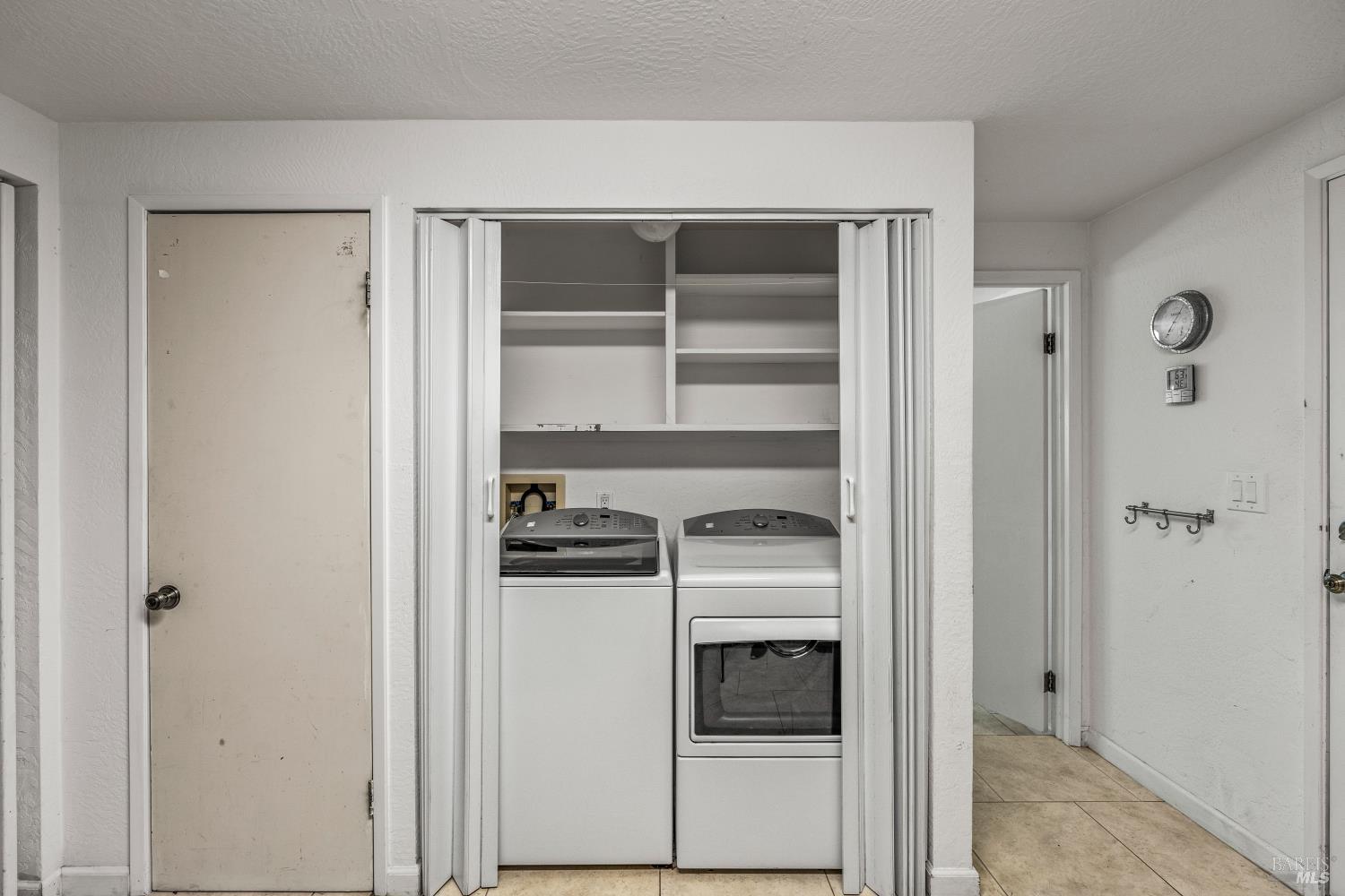 625-629 Hill Road Angwin, CA 94508 - Photo 26 of 64 a kitchen with a refrigerator and cabinets