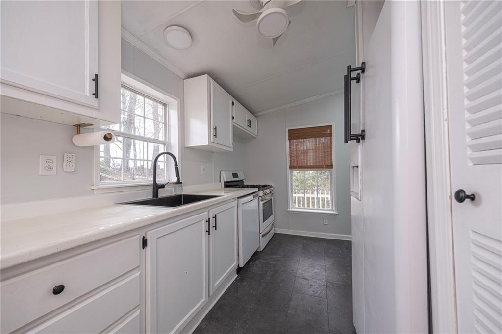 111 Leopard Road Evans City, PA 16033 - Photo 14 of 43 a kitchen with sink and cabinets