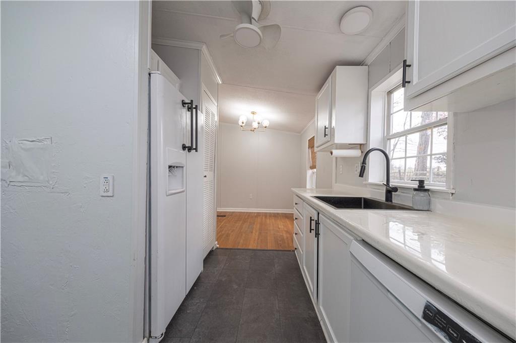 111 Leopard Road Evans City, PA 16033 - Photo 17 of 43 a kitchen with granite countertop a sink and cabinets