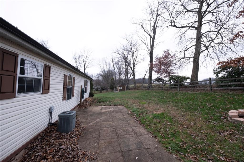 111 Leopard Road Evans City, PA 16033 - Photo 30 of 43 a white house that has tree in front of it