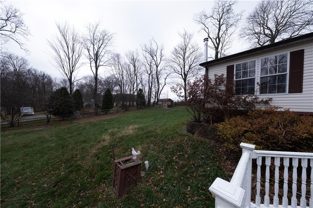 111 Leopard Road Evans City, PA 16033 - Photo 36 of 43 a view of backyard with deck and garden