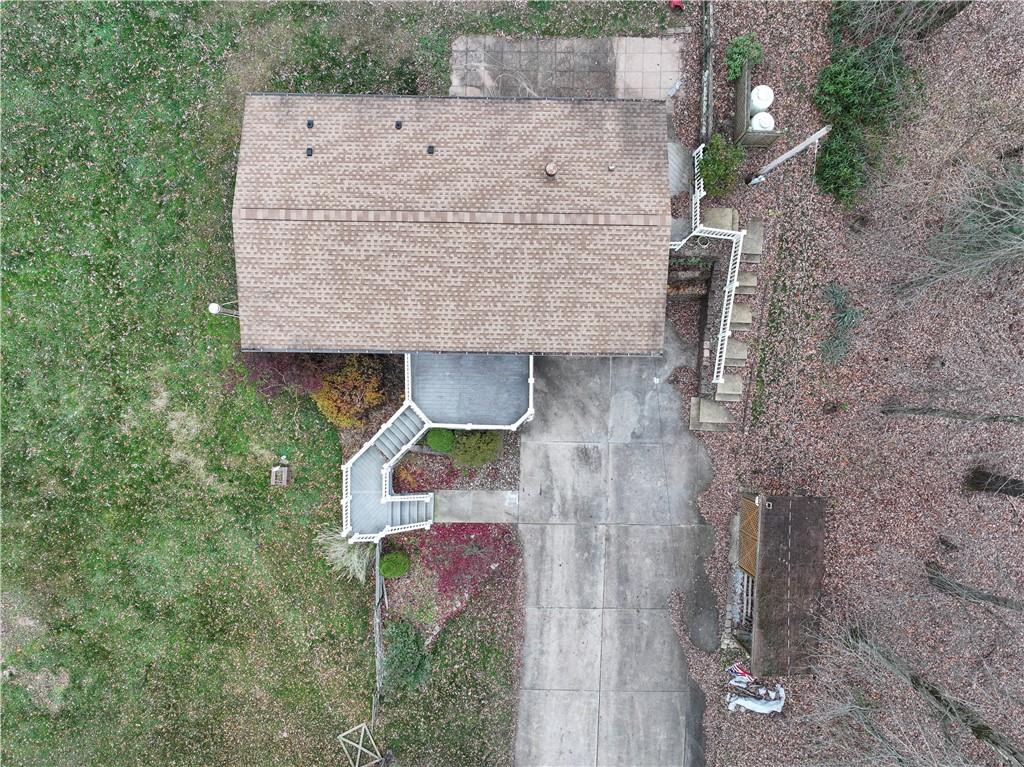 111 Leopard Road Evans City, PA 16033 - Photo 38 of 43 an aerial view of a house with a yard and wooden fence