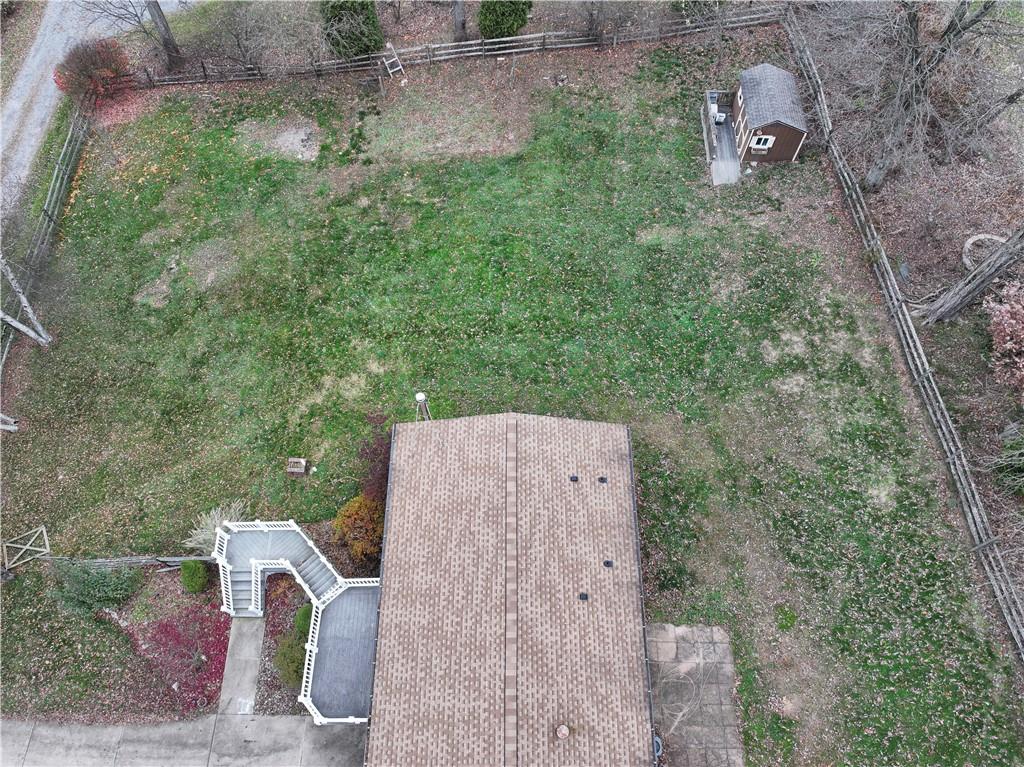 111 Leopard Road Evans City, PA 16033 - Photo 39 of 43 an aerial view of a house with backyard space and garden