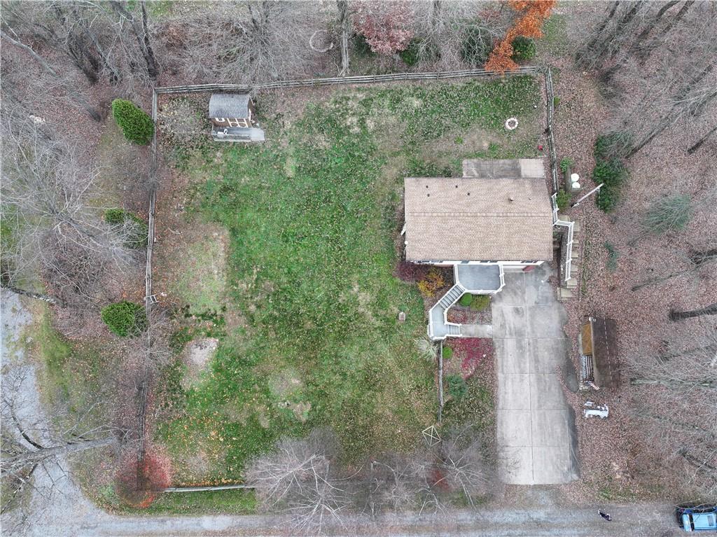 111 Leopard Road Evans City, PA 16033 - Photo 4 of 43 an aerial view of a house with a yard and lake