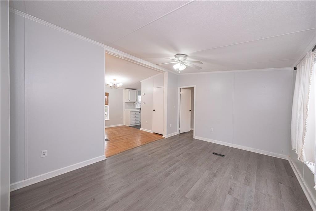 111 Leopard Road Evans City, PA 16033 - Photo 10 of 43 a view of an empty room with wooden floor