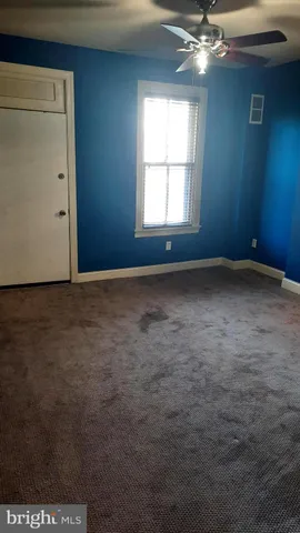 a view of an empty room and window