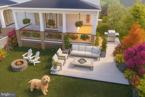 a front view of a house with garden and patio