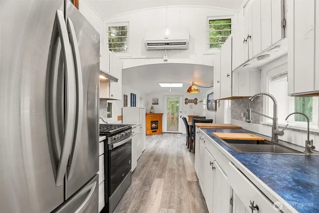a view of kitchen with cabinets and wooden floor