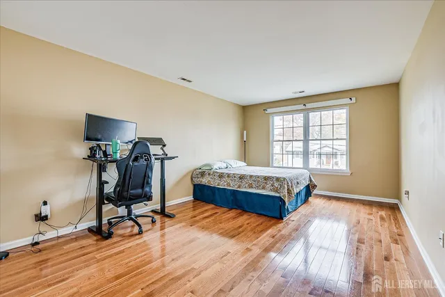 a bedroom with a bed and a table